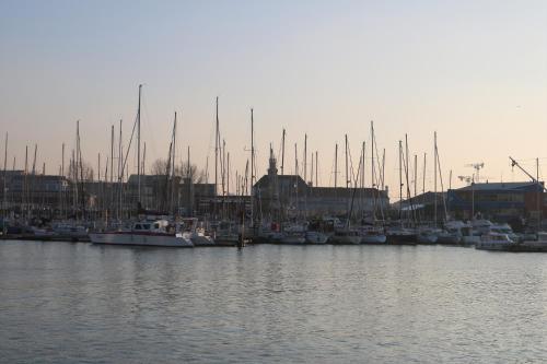a group of boats docked in a harbor at Hotel Le Transat Bleu in Dunkerque
