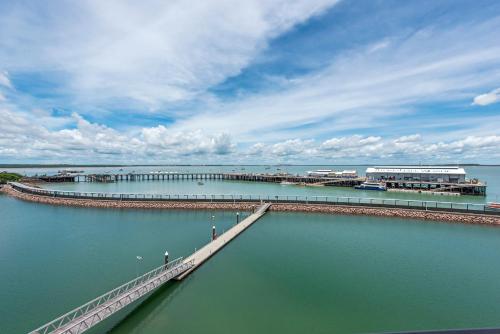 a pier in the middle of a body of water at Darwin Waterfront Luxury Suites in Darwin
