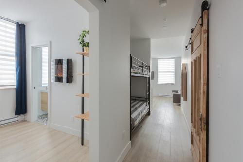 Un ou plusieurs lits dans un hébergement de l'établissement Les Lofts Ste-Anne