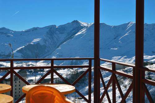 a balcony with a view of a snow covered mountain at Hotel Toni in Gudauri