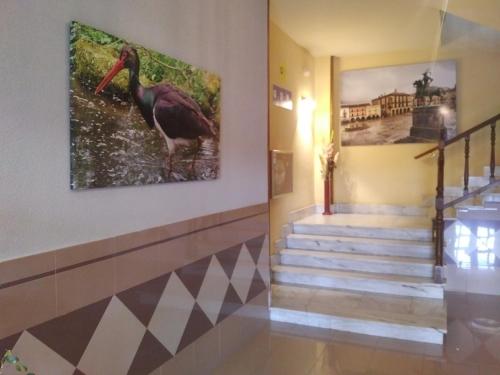 a hallway with a painting of a turkey on the wall at Hotel Perú by Bossh! Hotels in Trujillo