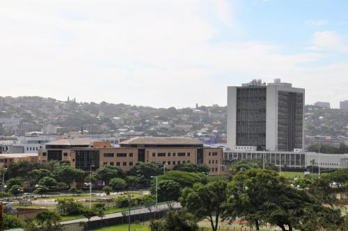 a view of a city with a tall building at ONOMO Hotel Durban in Durban