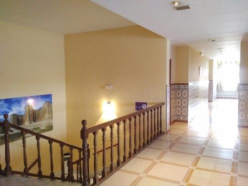 a staircase in a house with a painting on the wall at Hotel Perú by Bossh! Hotels in Trujillo