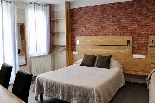 Cama o camas de una habitación en Hotel des Pyrénées