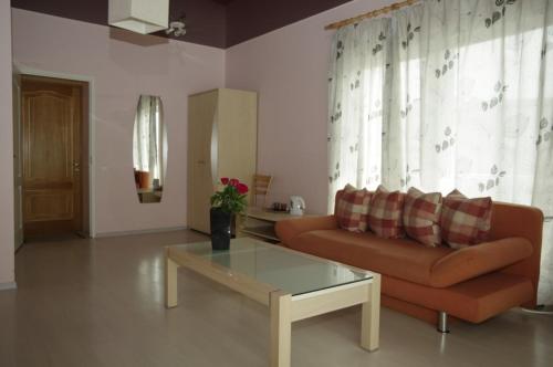 a living room with a couch and a coffee table at Europe Guesthouse in Narva