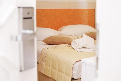 a bedroom with two beds and a door to a room at Villa Palloma in Baška Voda