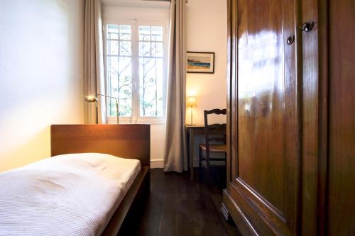 Postel nebo postele na pokoji v ubytování la Pinède