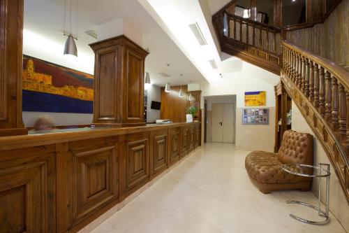 
a large wooden staircase leading up to a kitchen at Hotel Don Curro in Málaga
