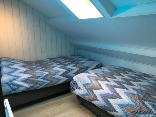 Un pat sau paturi într-o cameră la La Cime des chodes 2