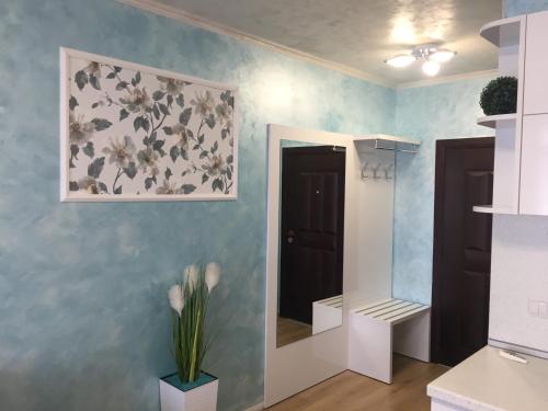 a room with a flower painting on the wall at Stela Apartments in Obzor