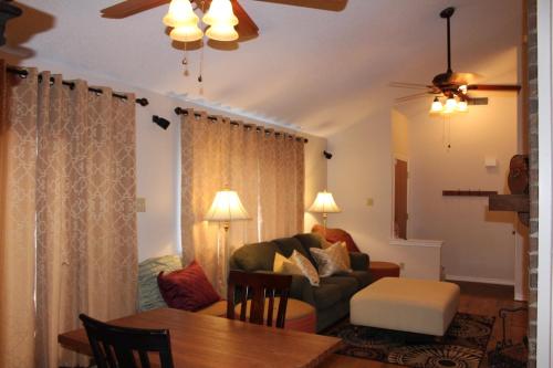 a living room with a couch and a table at Comfy Cozy Affordable Home Away Home in Garland