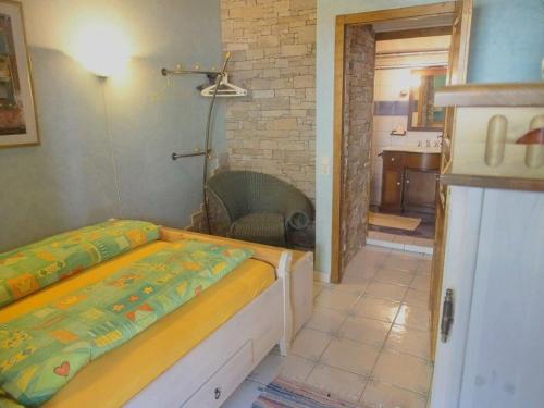 a bedroom with a bed and a bathroom at Casa ai Ghiri in Cannero Riviera