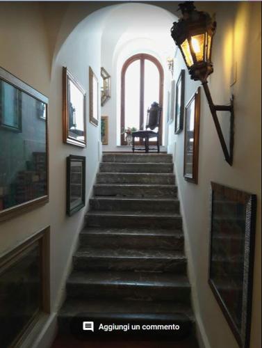 a staircase in a building with a light at the top at Villa Chiarenza Maison d'Hotes in Giardini Naxos