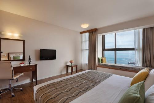 TV a/nebo společenská místnost v ubytování Nof Hotel