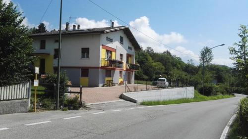 a house sitting on the side of a road at B&B Tisoi in Belluno