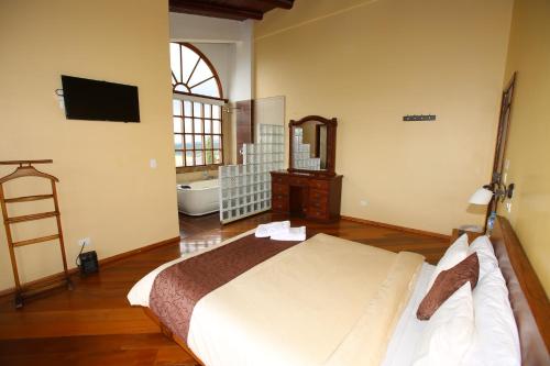 Katil atau katil-katil dalam bilik di Hosteria Loma Larga Cayambe