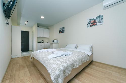 FlatRent SmartHouseにあるベッド