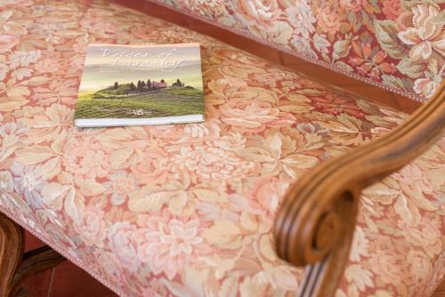 a book sitting on top of a table at Fattoria Pian Di Rocca in Castiglione della Pescaia