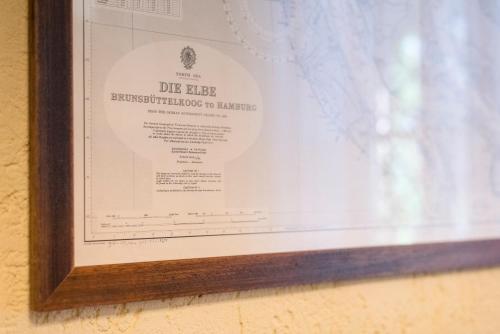 a picture in a frame hanging on a wall at Fattoria Pian Di Rocca in Castiglione della Pescaia