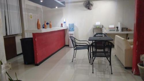 a kitchen with a table and chairs in a room at Hotel Marina Campeche in Campeche