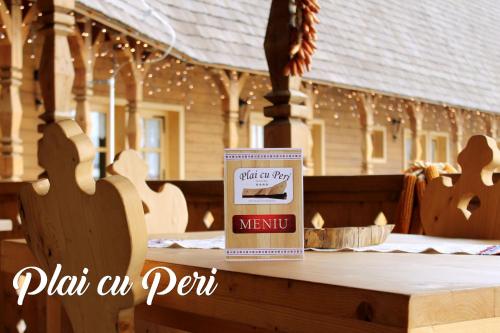 a box of food sitting on top of a table at "Plai cu Peri" in Săpînţa