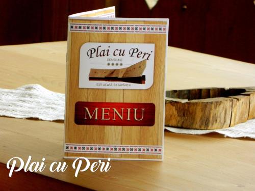 a box with a picture of a piece of cake at "Plai cu Peri" in Săpînţa