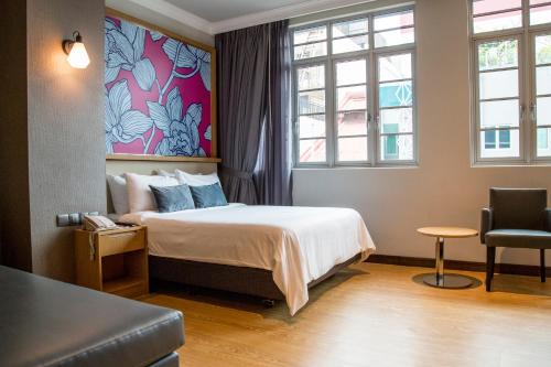 Postel nebo postele na pokoji v ubytování Hotel Bencoolen at Hong Kong Street