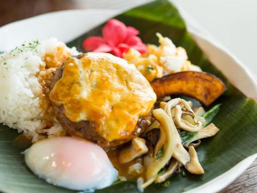 a plate of food with rice and meat and vegetables at Hotel AreaOne Sakaiminato Marina in Sakaiminato