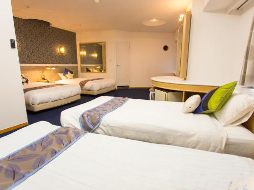 Krevet ili kreveti u jedinici u objektu Hotel AreaOne Sakaiminato Marina