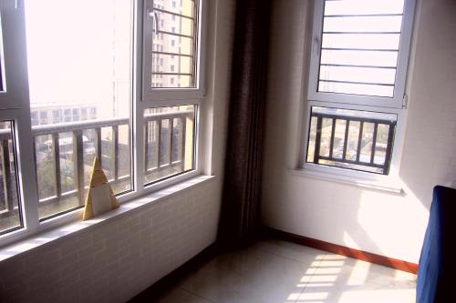 Fotografie z fotogalerie ubytování Sea View Apartment Qingdao North Railway Station Branch v destinaci Xiazangtuan