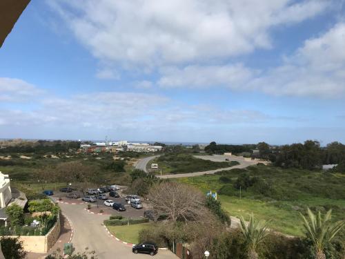 a view of a road with cars parked on it at Different Atmosphere Suite in Caesarea