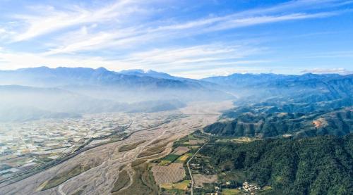 an aerial view of a valley in the mountains at Shan Yi Fang Resort in Yuanshan