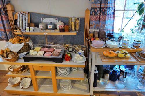 a room filled with lots of food on shelves at Landhotel Lacknerhof in Mariapfarr