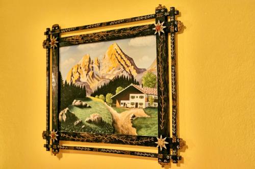 a picture of a painting of a house in a mountain at Rehwinkel in Bodenmais
