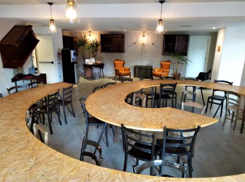 a large room with tables and chairs in it at Aiden by Best Western JHD Dunant Hotel in Castiglione delle Stiviere