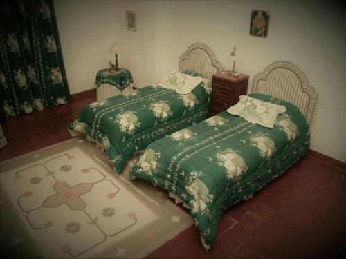 Katil atau katil-katil dalam bilik di El Solar de Belén