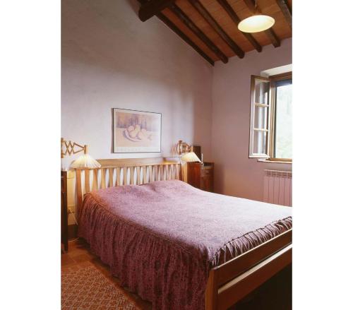 a bedroom with a bed and a window at Villa Magrini in San Gennaro