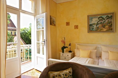 a bedroom with a bed and a window at Rhön Hotel Waldcafé St. Georg in Staatsbad Brückenau