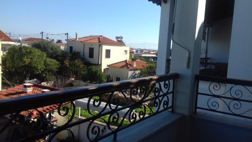 a balcony with a view of a city at studio nufaro in Mytilini