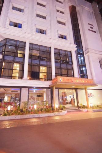 a building on a street with at Hotel The Sojourn in Kolkata