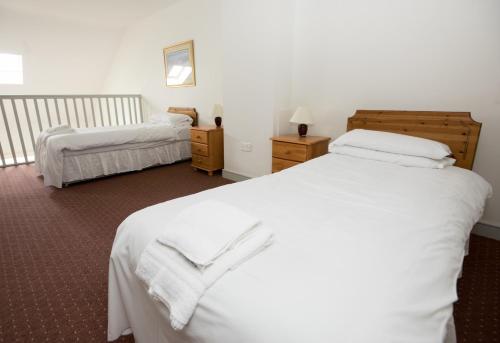 Łóżko lub łóżka w pokoju w obiekcie Spanish Cove Holiday Homes (Sleeps 5)