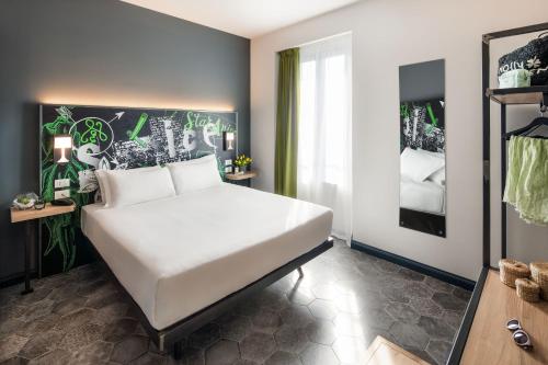 Postel nebo postele na pokoji v ubytování Spice Hotel Milano