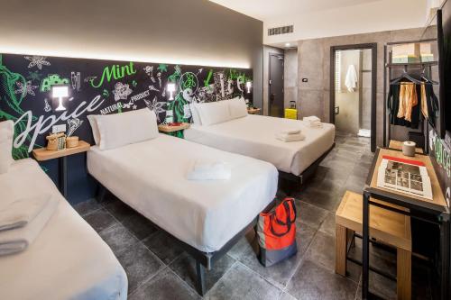 Postel nebo postele na pokoji v ubytování Spice Hotel Milano