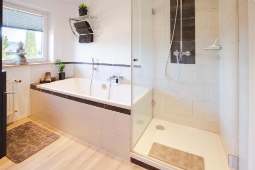 a bathroom with a shower and a sink at Karwendellounge in Krün