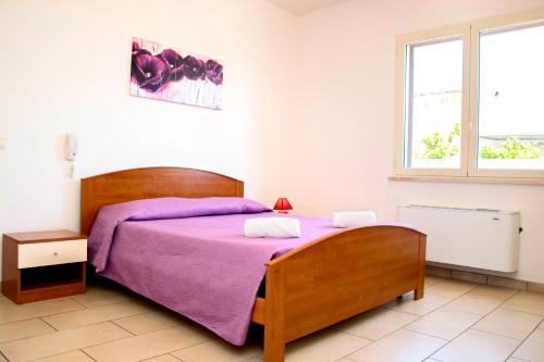 Postel nebo postele na pokoji v ubytování Casa Vacanze Eufemia