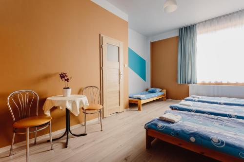 Postel nebo postele na pokoji v ubytování Hostel Tara