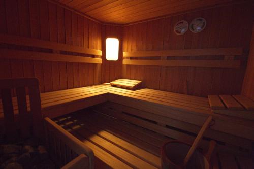 a sauna with a bench and a light in it at Gästehaus Walch-Riml in Imst