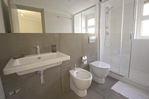 a bathroom with a sink and a toilet and a shower at B&B San Carlo in Lamezia Terme