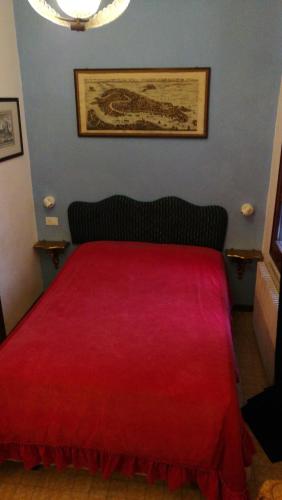 Postel nebo postele na pokoji v ubytování Alloggi alla Scala del Bovolo