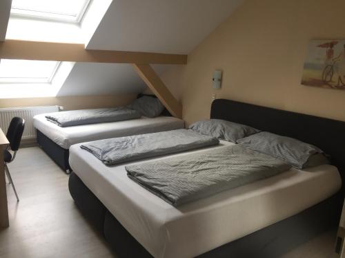 Postel nebo postele na pokoji v ubytování Hotel Amy